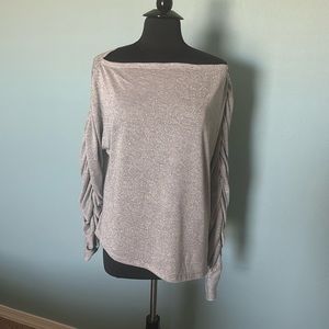 One state, brand new, glittery, silver long sleeve blouse.